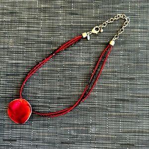 Chicos necklace in black and read beads with silver clasp.